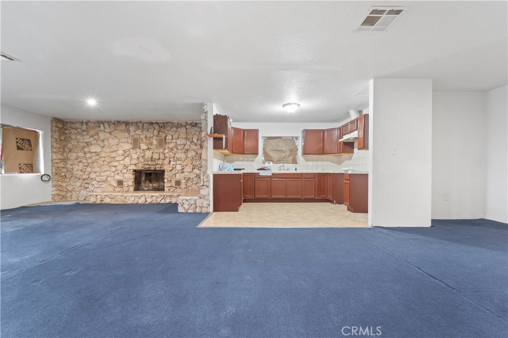 32900 Dune Road Newberry Springs, CA 92365 - Photo 10 of 40 a view of a livingroom with a fireplace