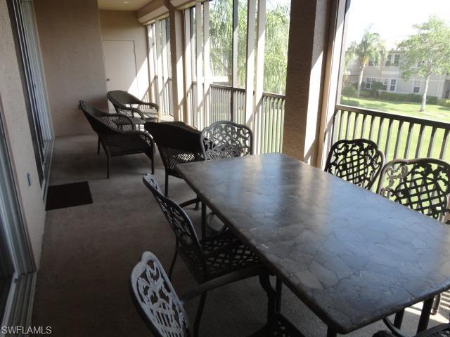 755 Regency Reserve Circle, Unit 5004 Naples, FL 34119 - Photo 13 of 24 a view of a livingroom with furniture and staircase