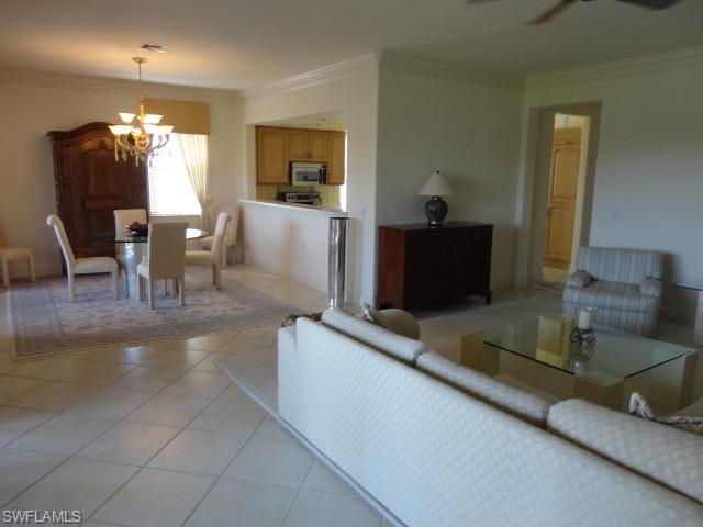 755 Regency Reserve Circle, Unit 5004 Naples, FL 34119 - Photo 18 of 24 a living room with furniture