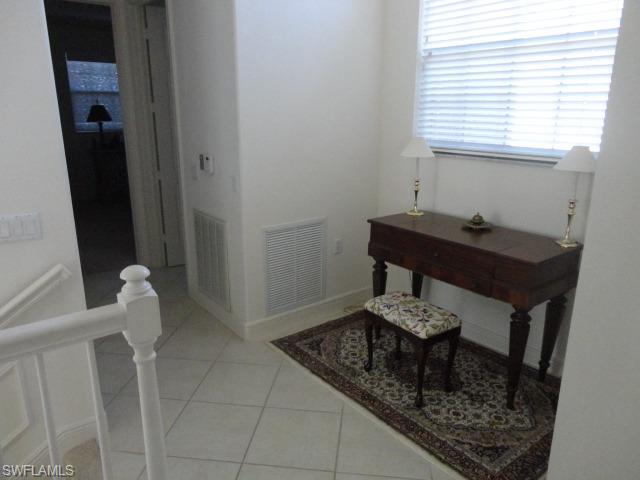 755 Regency Reserve Circle, Unit 5004 Naples, FL 34119 - Photo 21 of 24 a bathroom with a sink and a window