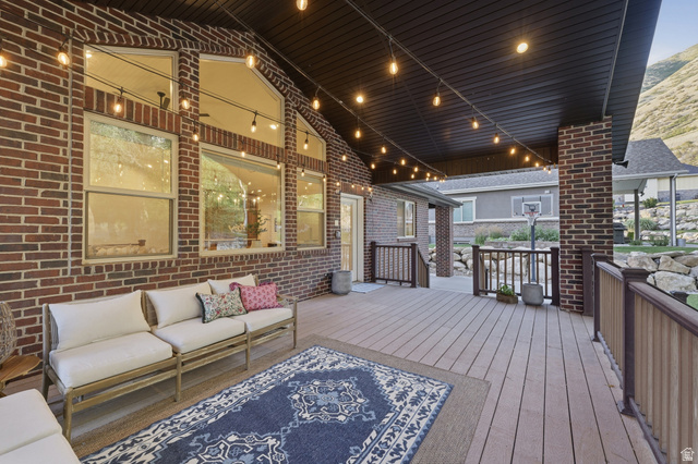 441 South 2080th Street East Springville, UT 84663 - Photo 44 of 64 Expansive covered deck featuring wood-finish flooring, brick columns, and a railing system