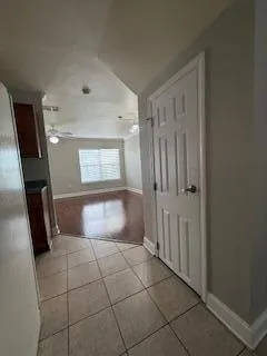 a bathroom with a vanity mirror and window