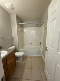 a bathroom with a shower a toilet and a shower