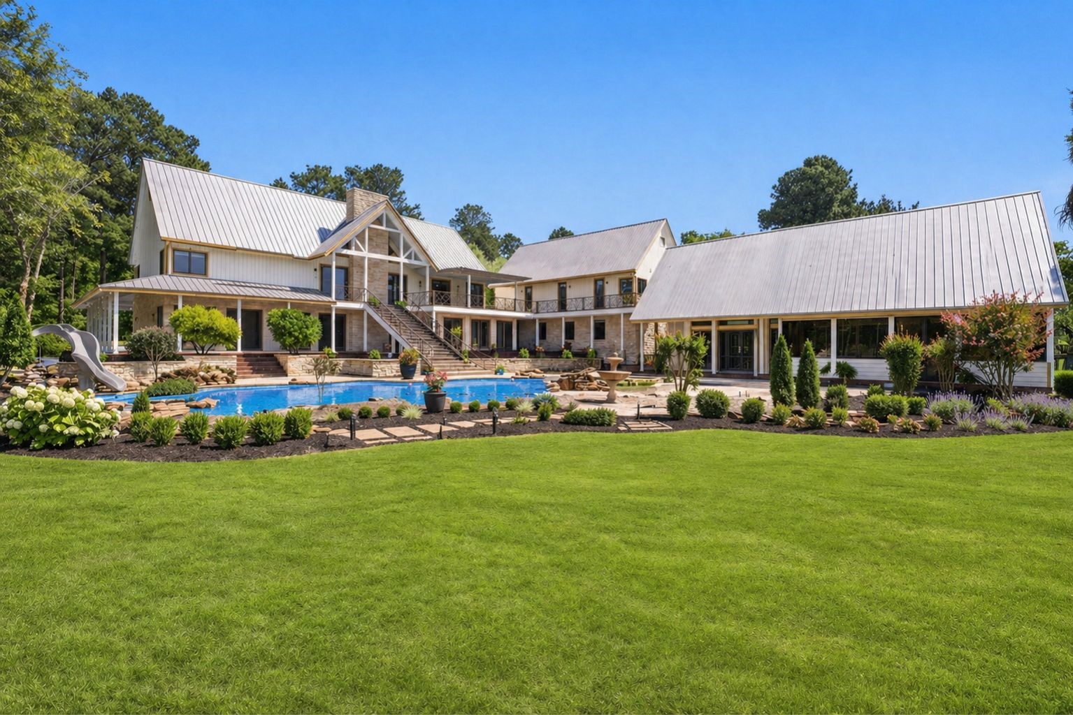 Welcome to your private oasis where the pool and spa serve as the centerpiece, surrounded by open skies, lush acreage, and peaceful waterfront views. (Some added AI greenery)