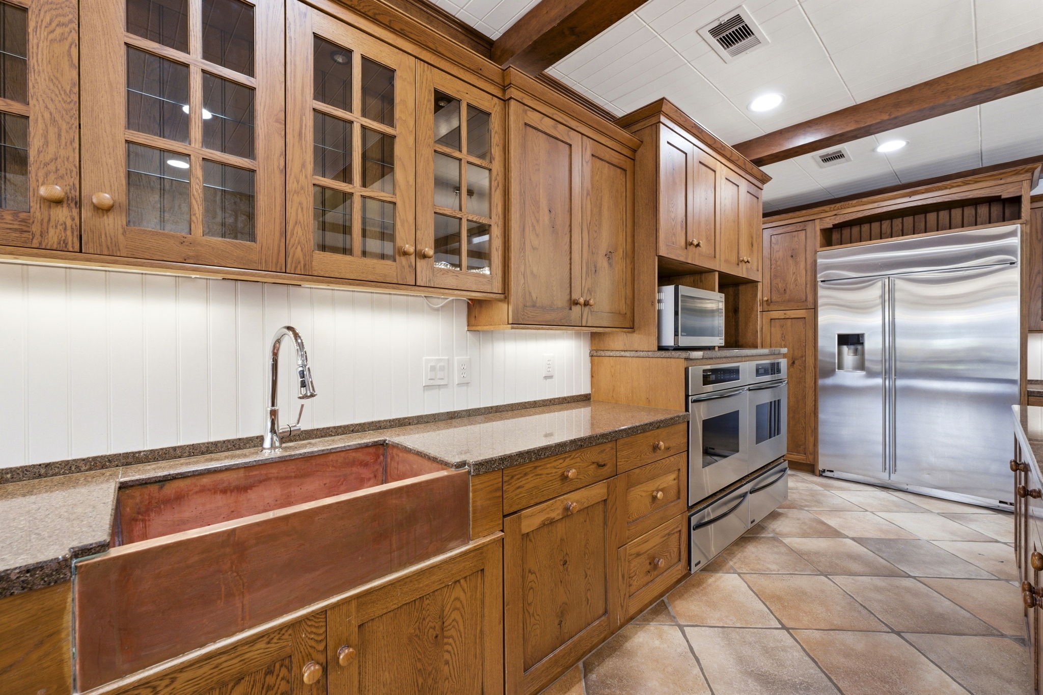 43 Pool Road Richards, TX 77873 - Photo 22 of 50 a kitchen with stainless steel appliances a sink and cabinets