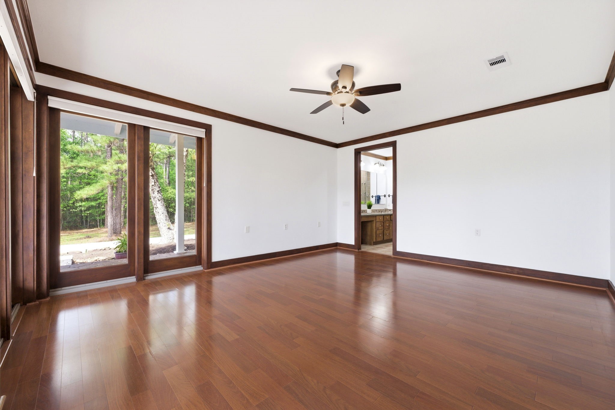 43 Pool Road Richards, TX 77873 - Photo 24 of 50 a view of empty room with wooden floor and fan