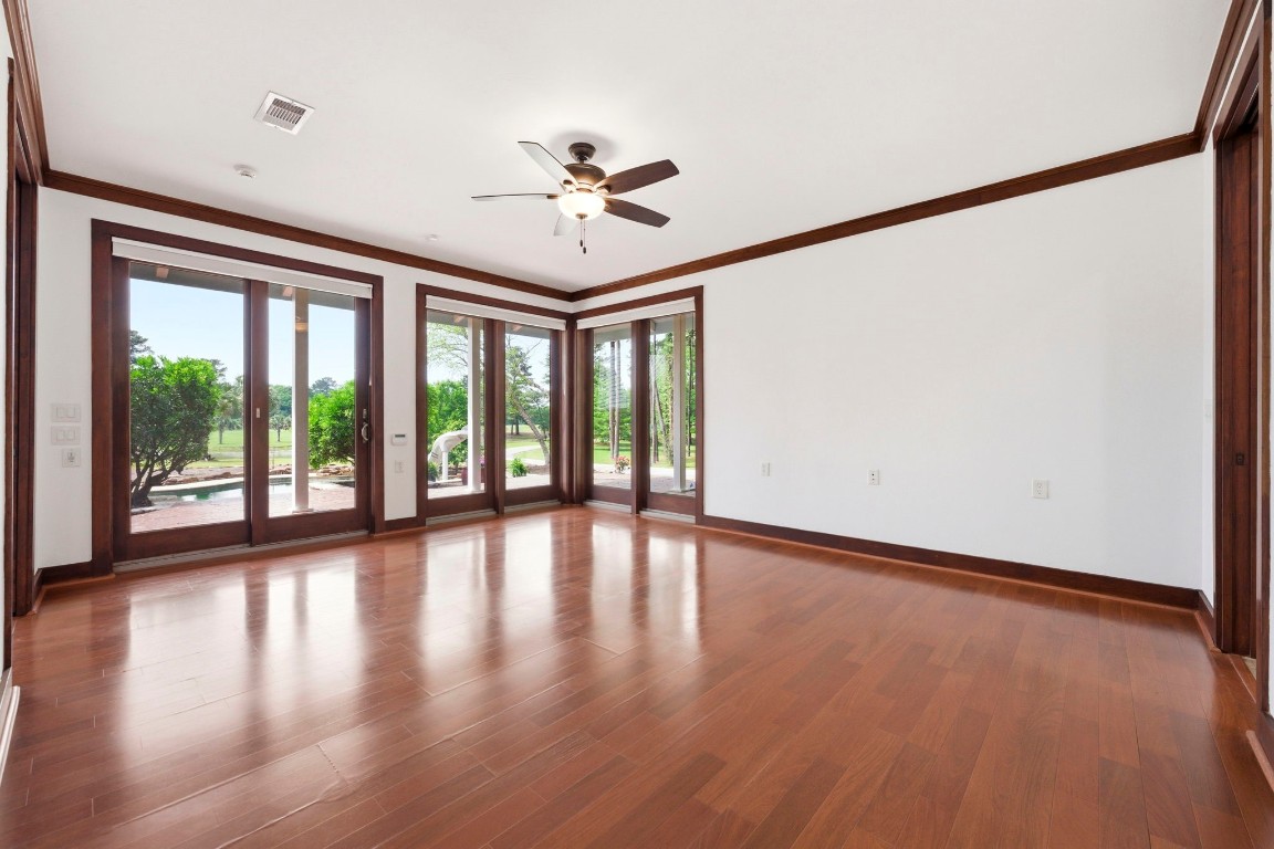 43 Pool Road Richards, TX 77873 - Photo 27 of 50 a view of an empty room with wooden floor and a window