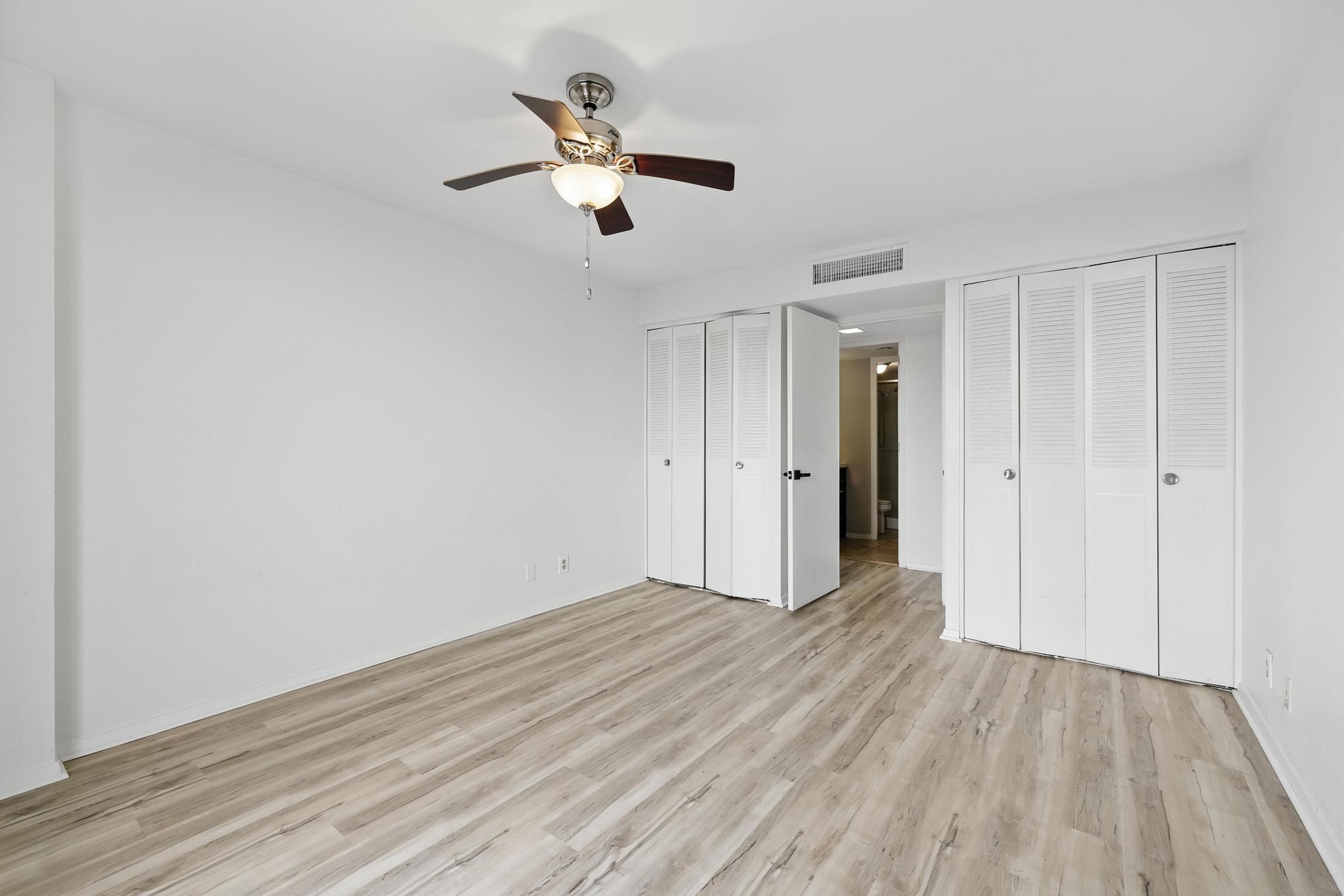 2016 Main Street, Unit 1502 Houston, TX 77002 - Photo 9 of 20 a view of an empty room with wooden floor
