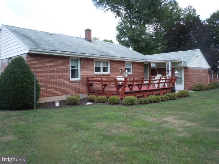 168 South Pleasantview Road Pottstown, PA 19464 - Photo 11 of 13 a front view of a house with garden