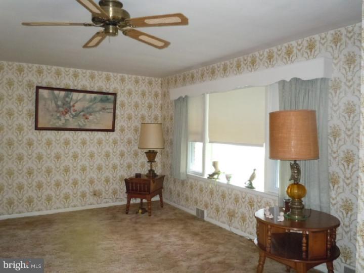 168 South Pleasantview Road Pottstown, PA 19464 - Photo 3 of 13 a living room with furniture and a window