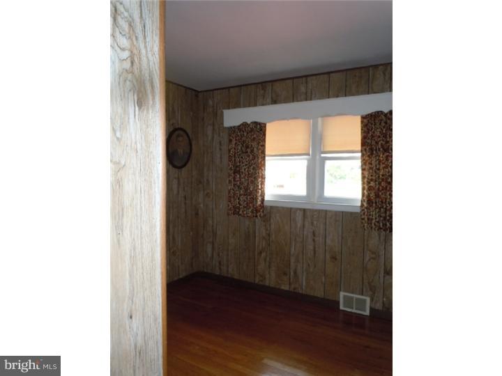 168 South Pleasantview Road Pottstown, PA 19464 - Photo 8 of 13 a view of an empty room with wooden floor