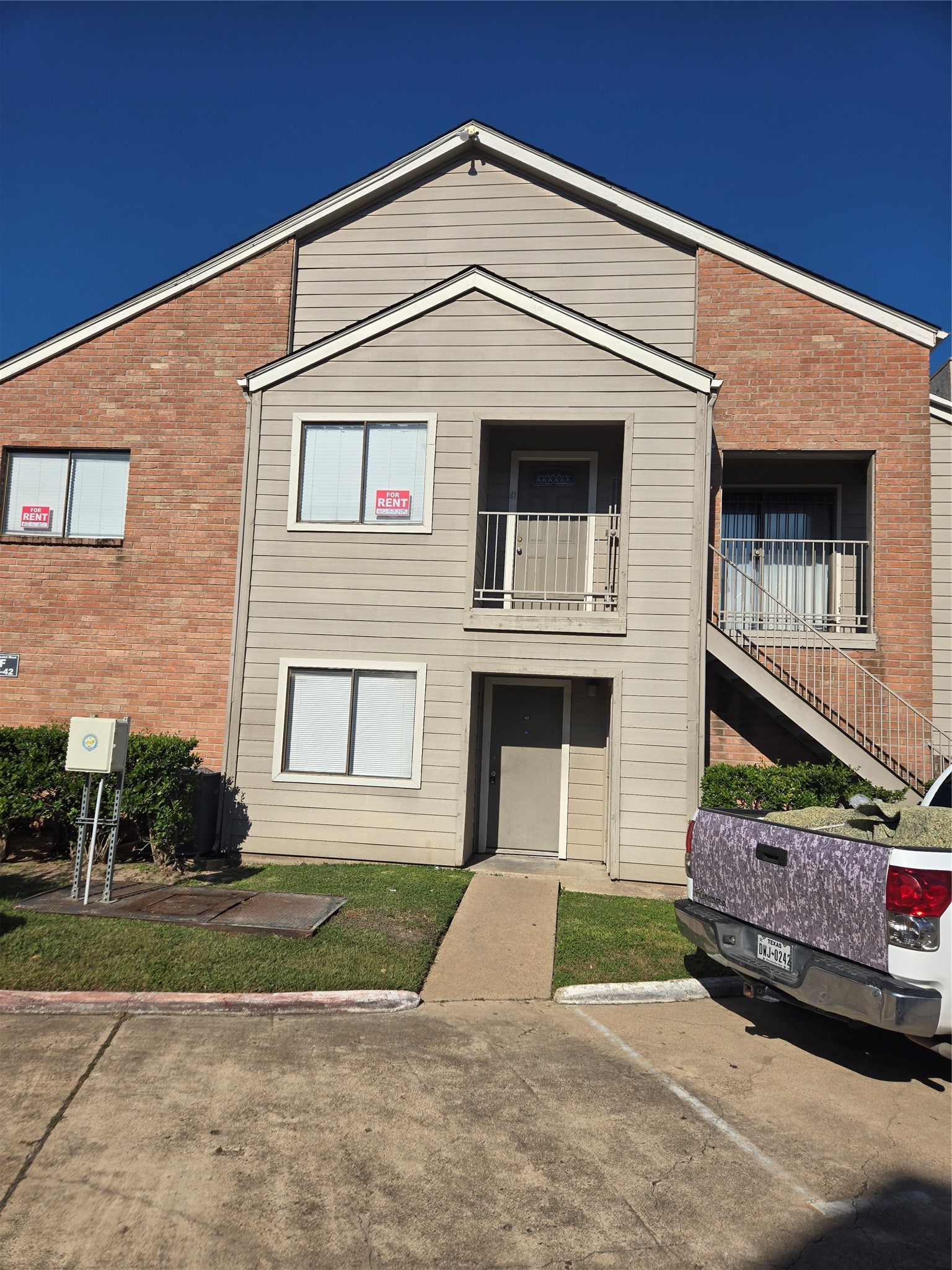 6701 Sands Point Drive, Unit 42 Houston, TX 77074 - Photo 1 of 12 a front view of a house with garage