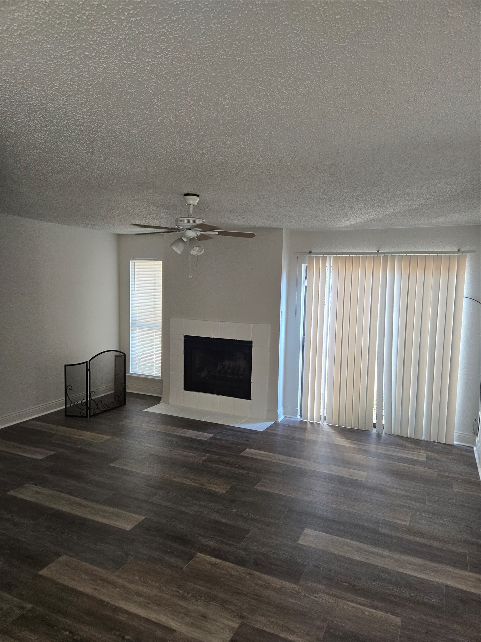 6701 Sands Point Drive, Unit 42 Houston, TX 77074 - Photo 4 of 12 a view of empty room with wooden floor and fireplace