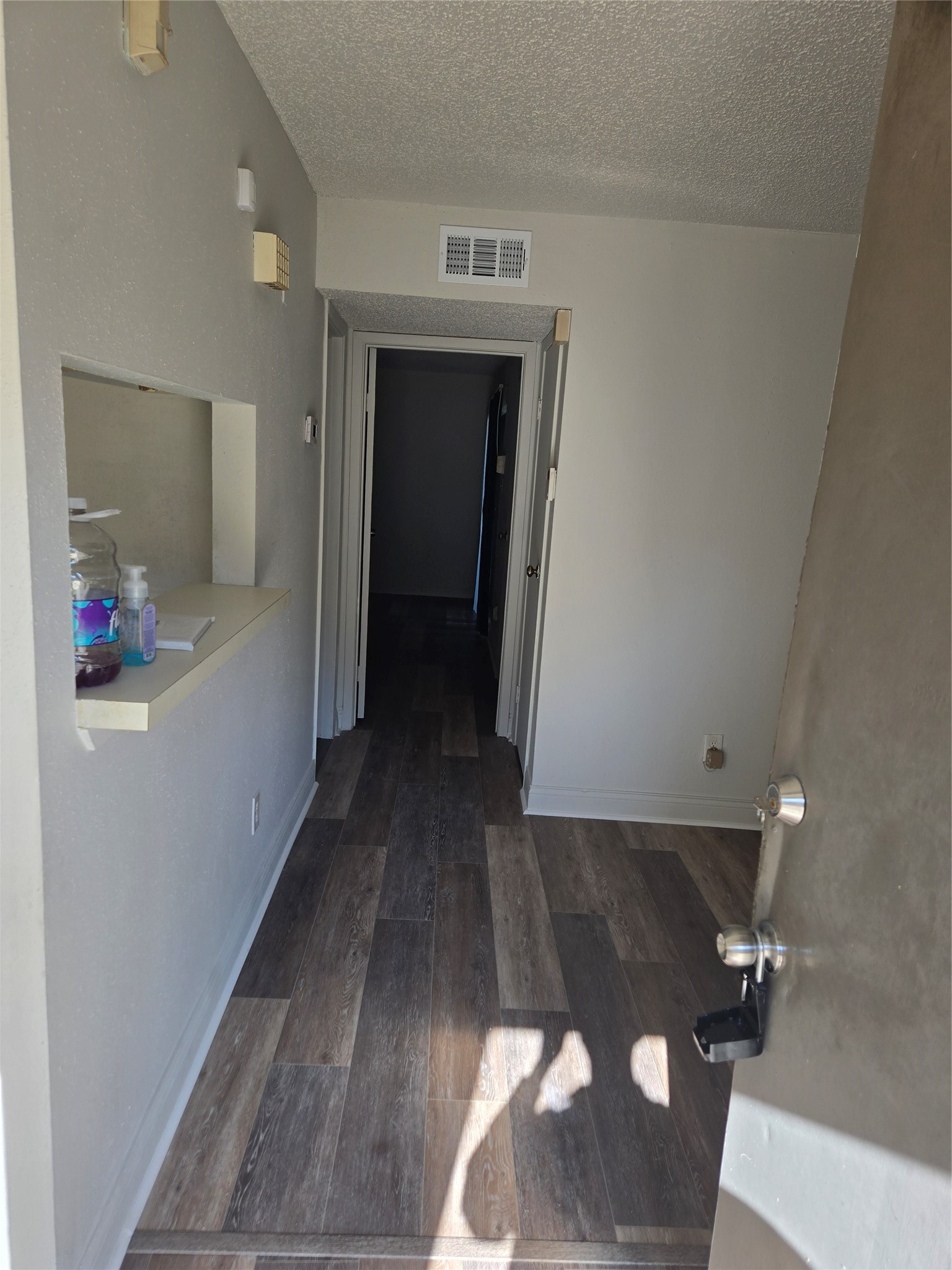 6701 Sands Point Drive, Unit 42 Houston, TX 77074 - Photo 6 of 12 a view of hallway with wooden floor