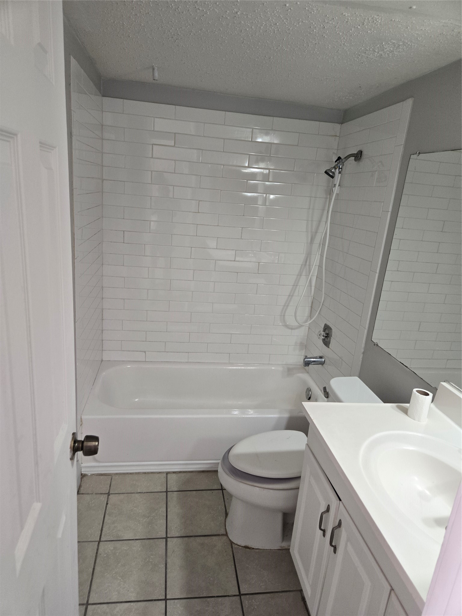6701 Sands Point Drive, Unit 42 Houston, TX 77074 - Photo 9 of 12 a bathroom with a sink a toilet and shower