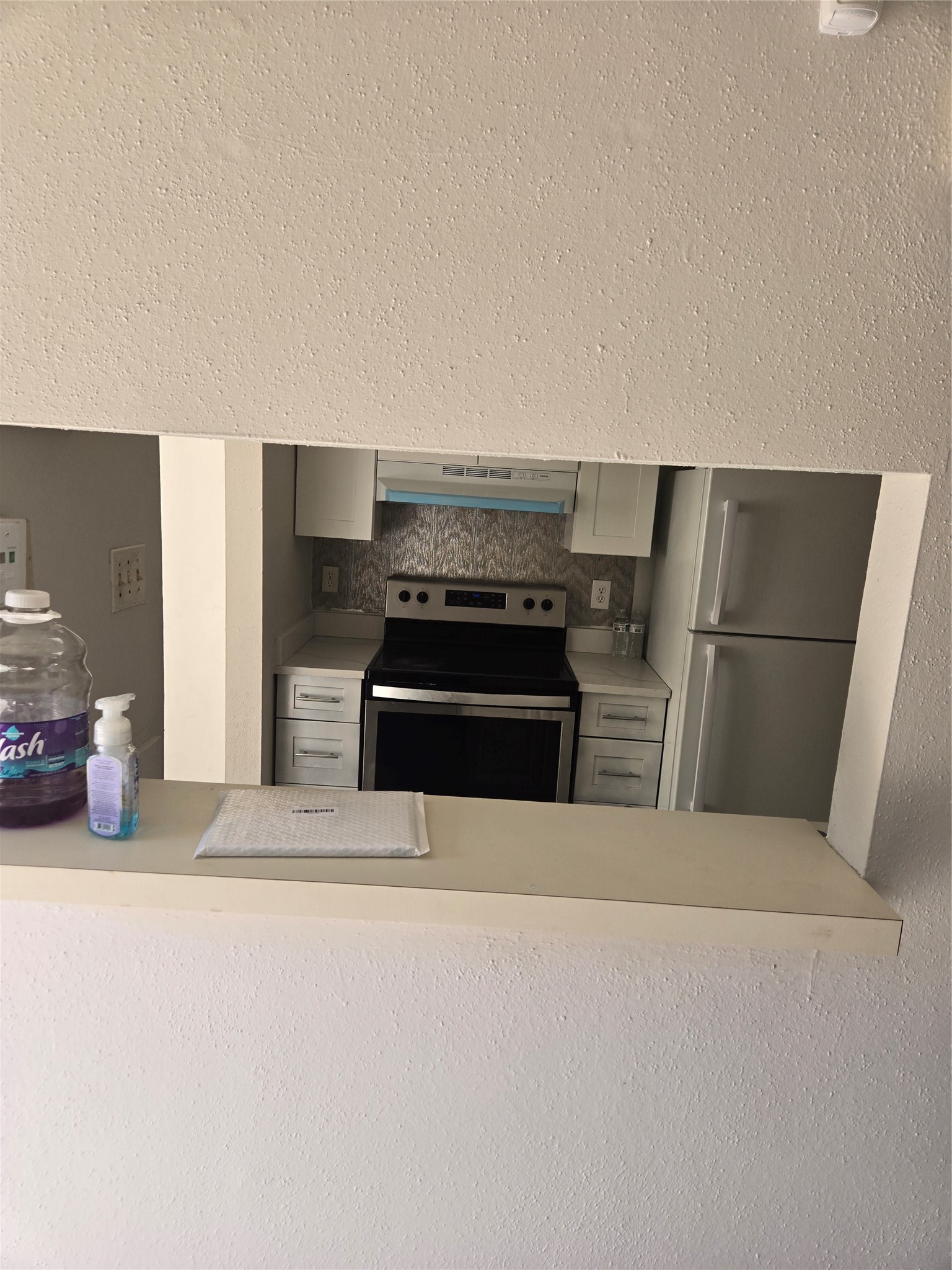 6701 Sands Point Drive, Unit 42 Houston, TX 77074 - Photo 10 of 12 a kitchen with a refrigerator and a stove