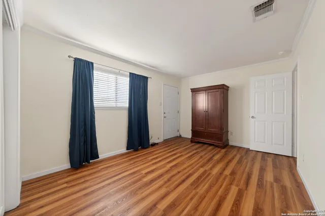 a view of a room with a wooden floor