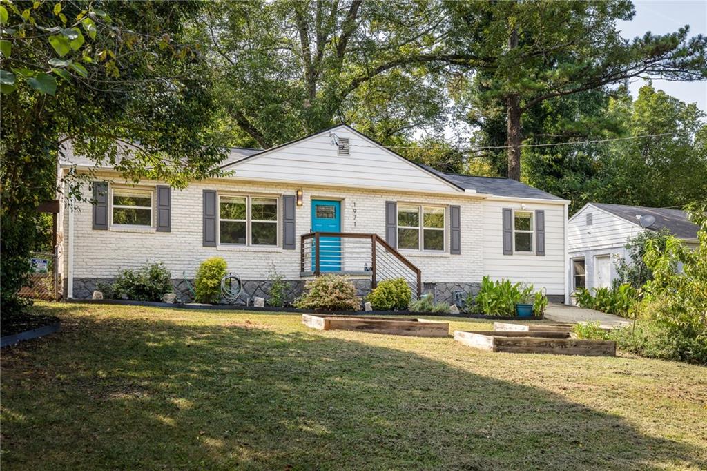 1971 Meadow Lane Decatur, GA 30032 - Photo 1 of 1 a front view of a house with a yard