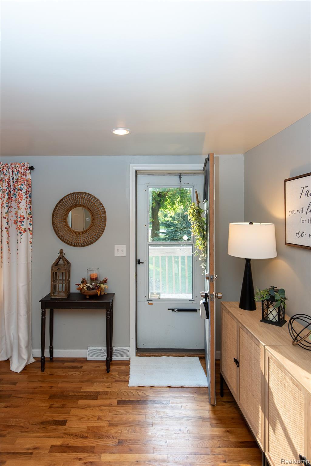 4034 Genesee Flint, MI 48506 - Photo 11 of 36 Doorway to outside featuring wood finished floors and recessed lighting