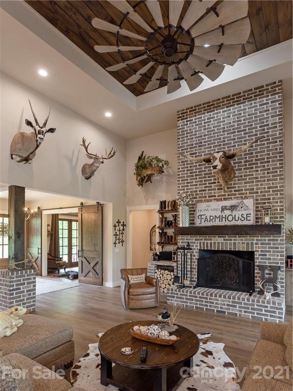 570 Parkway North Rd Mill Spring Mill Spring, NC 28756 - Photo 14 of 48 a living room with furniture and a fireplace