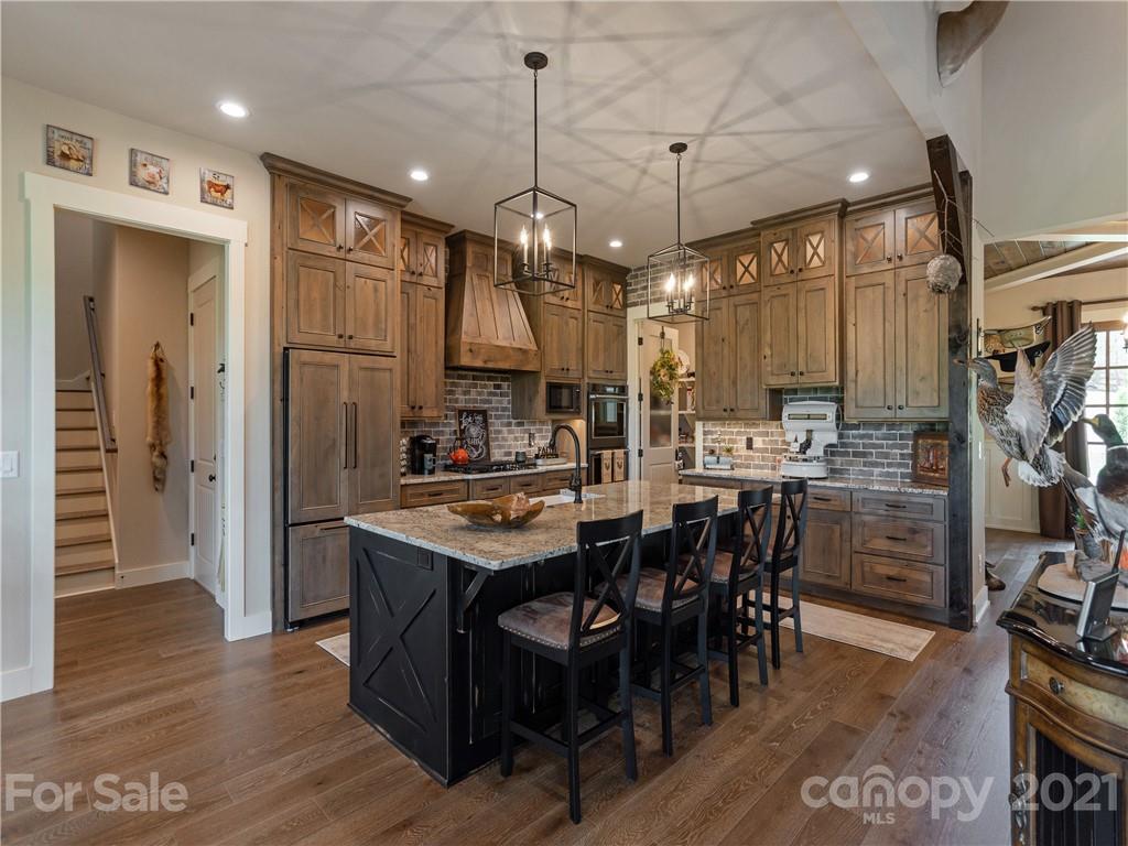 570 Parkway North Rd Mill Spring Mill Spring, NC 28756 - Photo 16 of 48 a large kitchen with a table and chairs