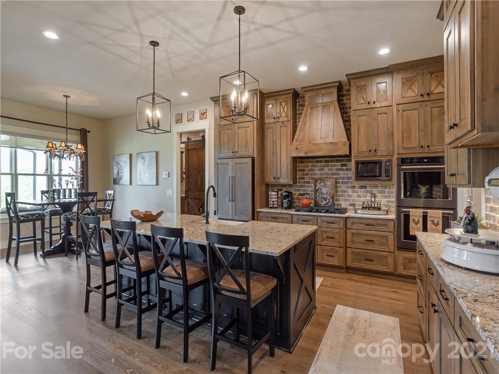 570 Parkway North Rd Mill Spring Mill Spring, NC 28756 - Photo 19 of 48 a large kitchen with a table and chairs