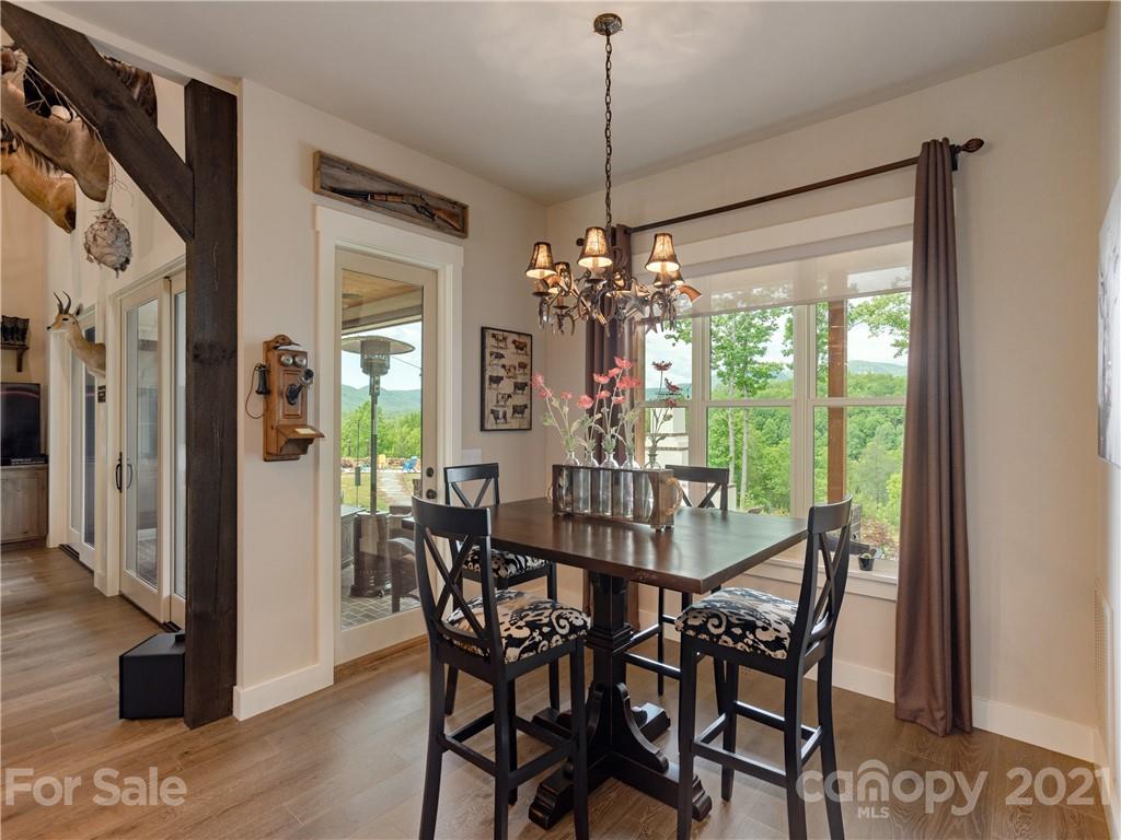570 Parkway North Rd Mill Spring Mill Spring, NC 28756 - Photo 20 of 48 a view of a dining room with furniture window and outside view