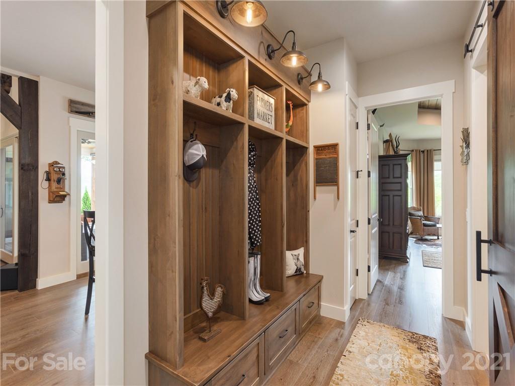 570 Parkway North Rd Mill Spring Mill Spring, NC 28756 - Photo 21 of 48 a view of a hallway with bathroom and wooden floor