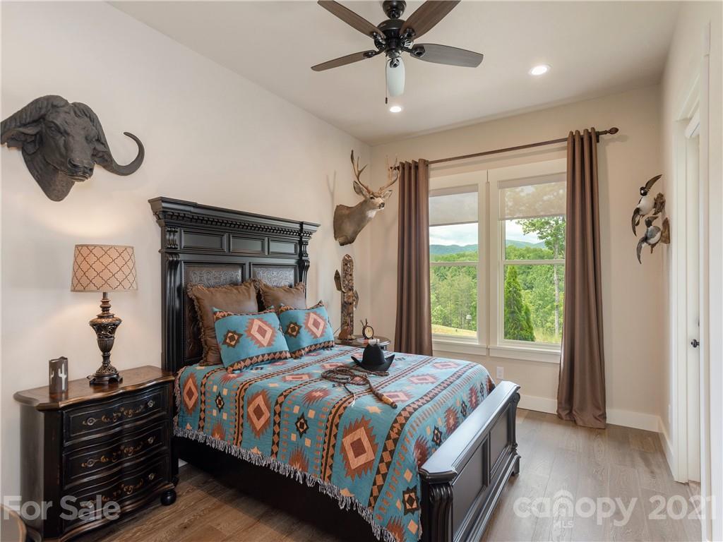 570 Parkway North Rd Mill Spring Mill Spring, NC 28756 - Photo 29 of 48 a bedroom with a large bed and a window