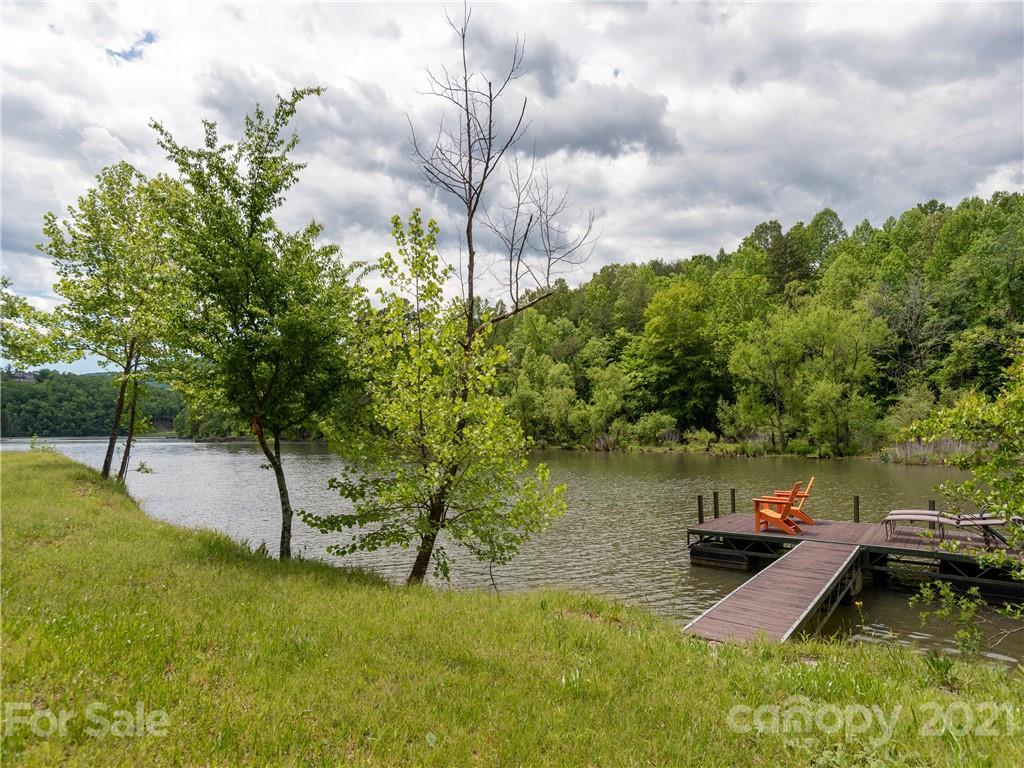 570 Parkway North Rd Mill Spring Mill Spring, NC 28756 - Photo 43 of 48 a view of a lake with a yard