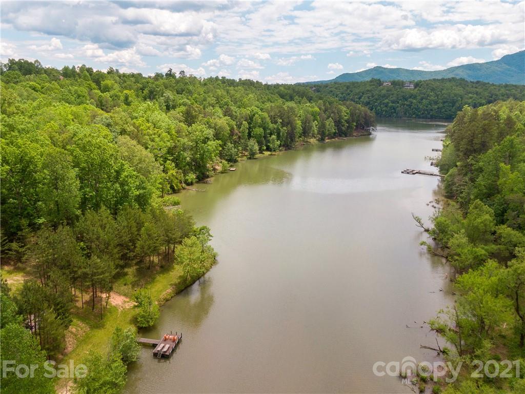 570 Parkway North Rd Mill Spring Mill Spring, NC 28756 - Photo 44 of 48 a view of a lake with a mountain in the background
