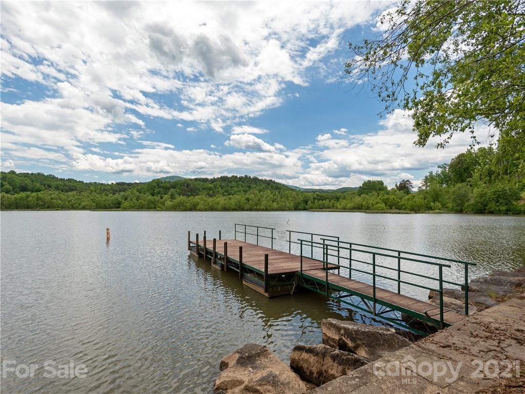 570 Parkway North Rd Mill Spring Mill Spring, NC 28756 - Photo 47 of 48 a view of a lake with houses in the back