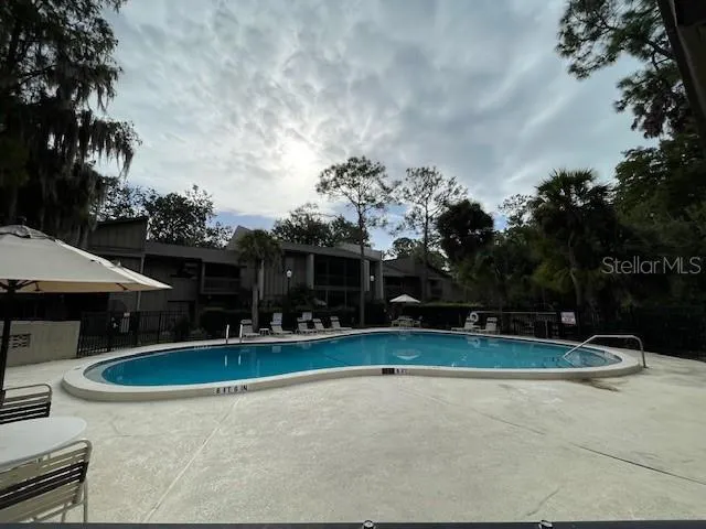 a view of swimming pool with a yard