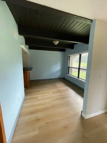 a view of an empty room with a window