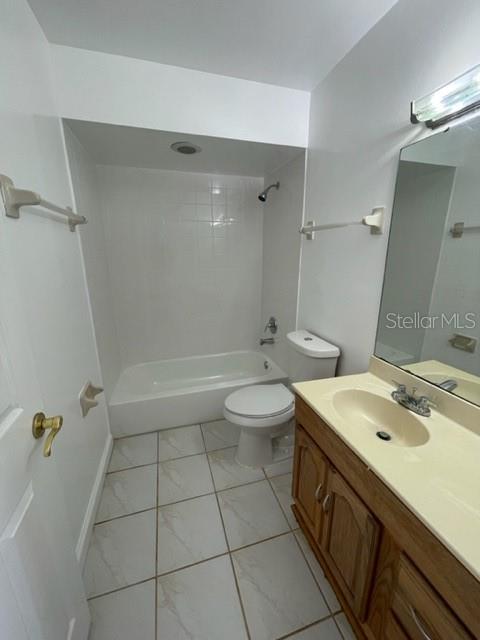 5466 Pine Creek Drive, Unit 2002 Orlando, FL 32811 - Photo 4 of 19 a bathroom with a double vanity sink toilet and shower