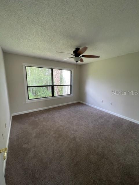 5466 Pine Creek Drive, Unit 2002 Orlando, FL 32811 - Photo 8 of 19 a view of an empty room with a window