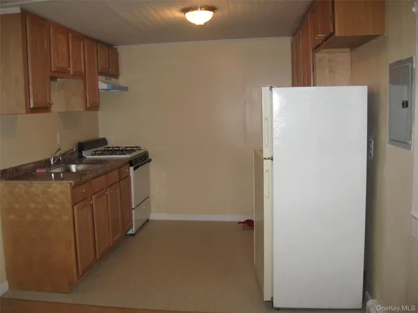 a utility room with sink dryer and washer