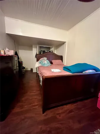 a bedroom with a bed and a closet