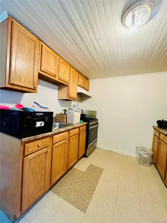 a kitchen that has a sink and a stove