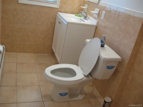 a bathroom with a toilet and a sink