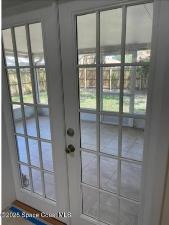a bathroom with sliding door and shower