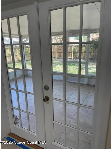 a bathroom with sliding door and shower
