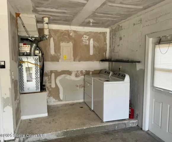 a utility room with cabinets