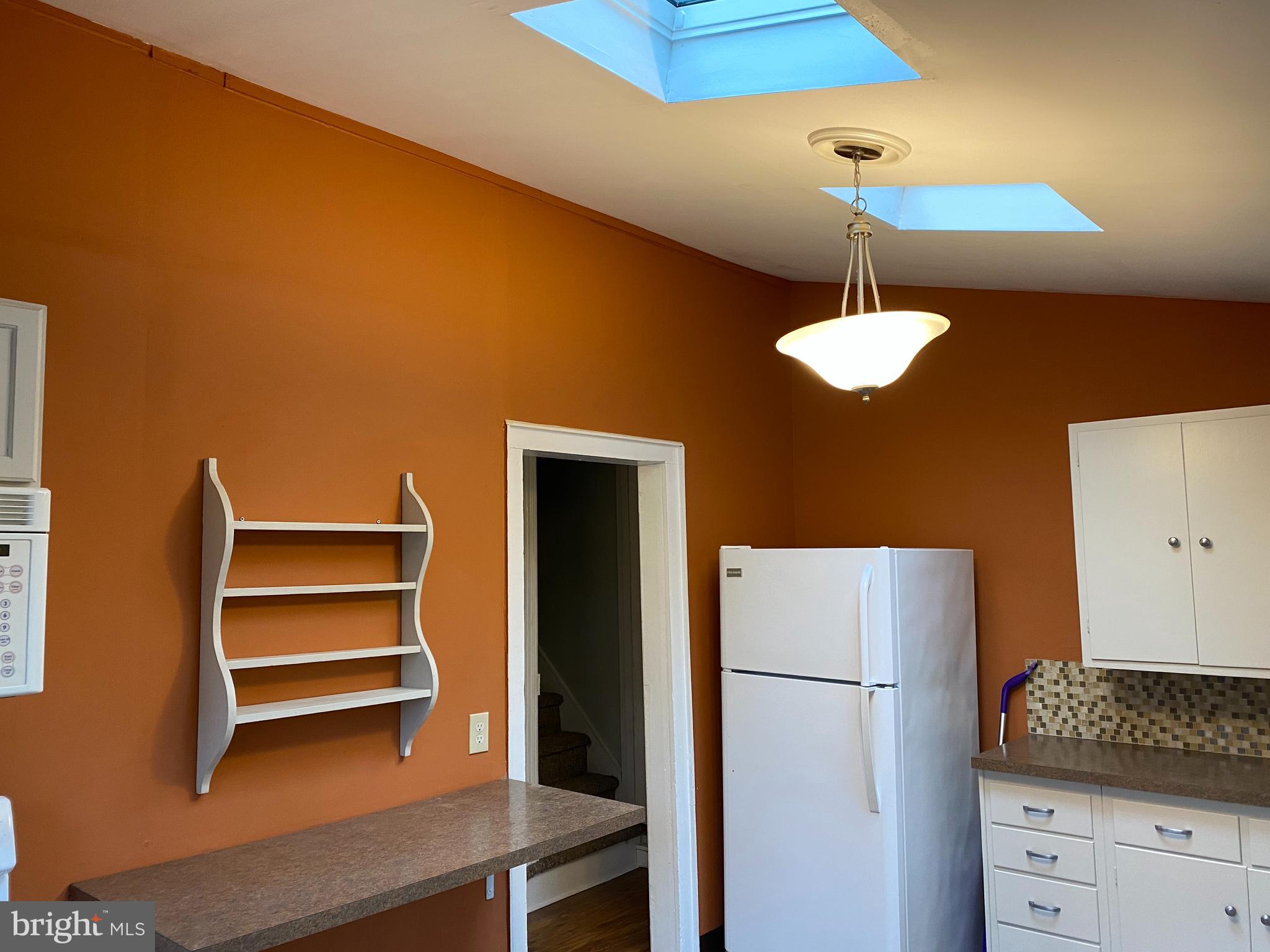 629 Convent Road Aston, PA 19014 - Photo 7 of 19 a kitchen with a refrigerator and cabinets