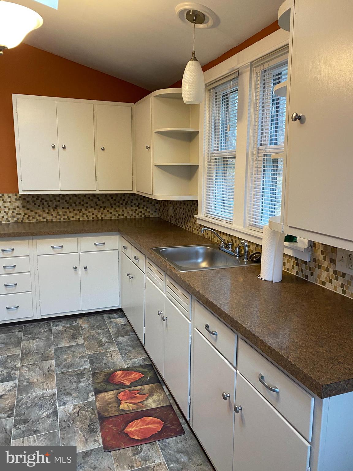 629 Convent Road Aston, PA 19014 - Photo 8 of 19 a kitchen with granite countertop a sink a stove and cabinets