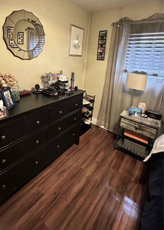 881 Broadway, Unit 9 Chelsea, MA 02150 - Photo 6 of 9 a room with wooden floors and couch