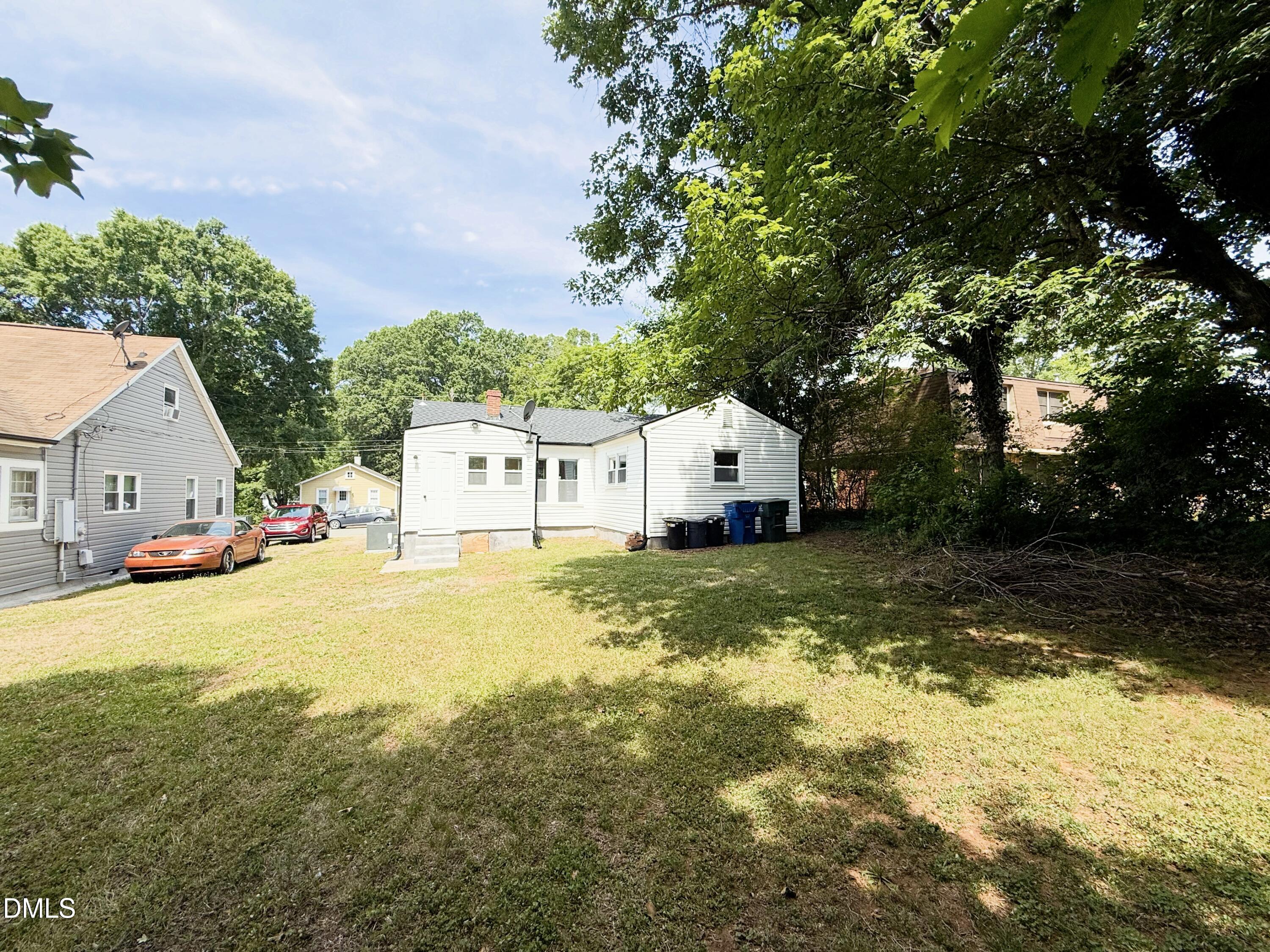 417 North Street Graham, NC 27253 - Photo 5 of 18 a view of a house with a yard garage and tree
