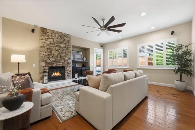 a living room with furniture and a fireplace