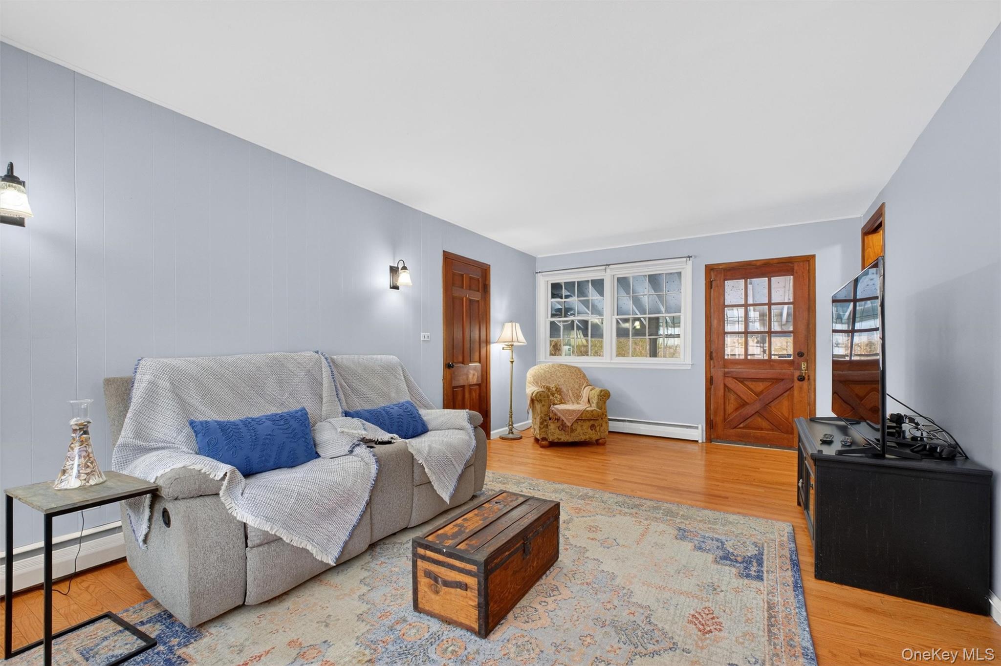 22 Hatfield Road Mahopac, NY 10541 - Photo 13 of 46 Large family room with door to screened in porch in the background.