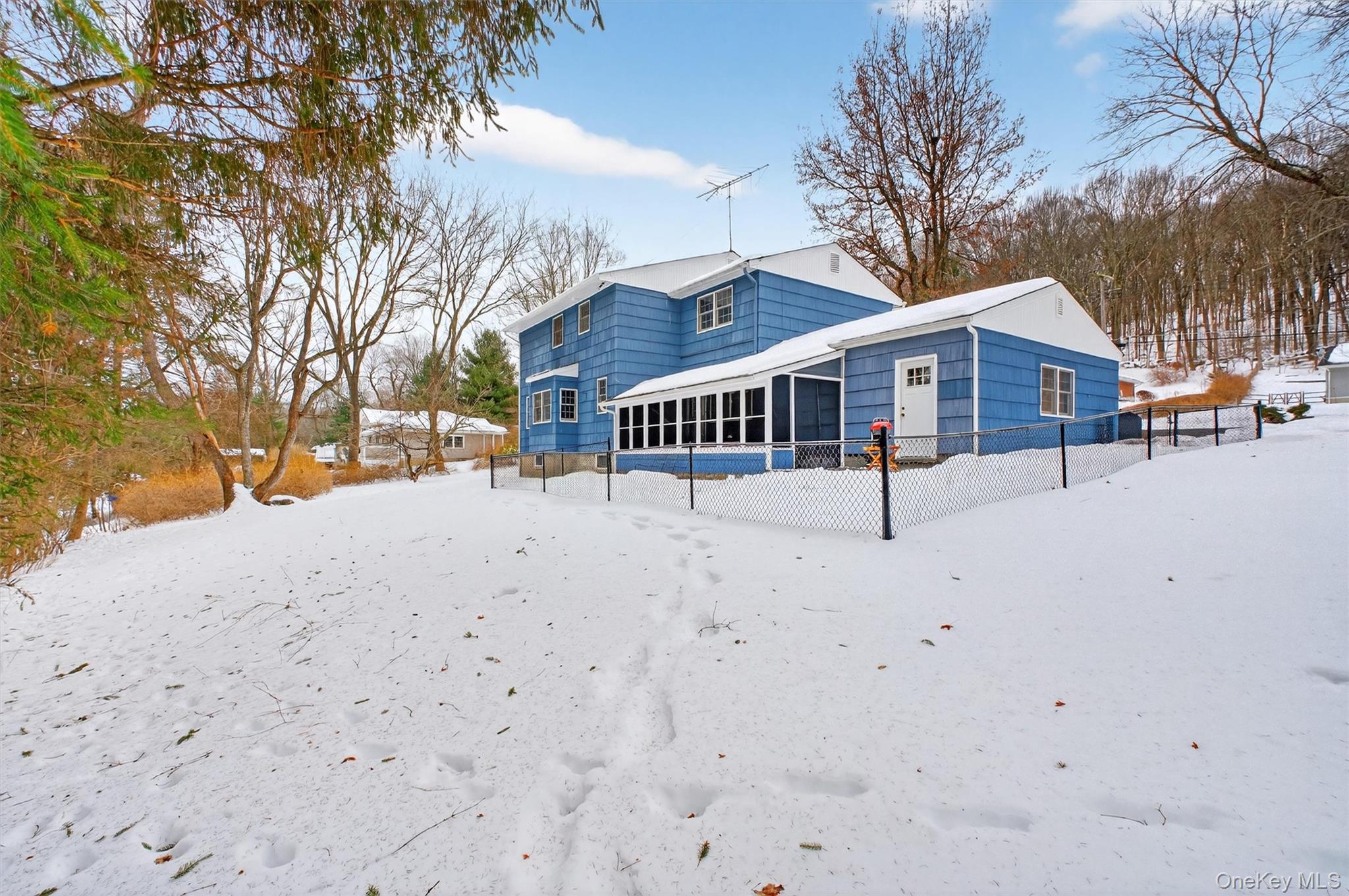 22 Hatfield Road Mahopac, NY 10541 - Photo 33 of 46 Photo showing screened in back porch and fenced in area for a dog.